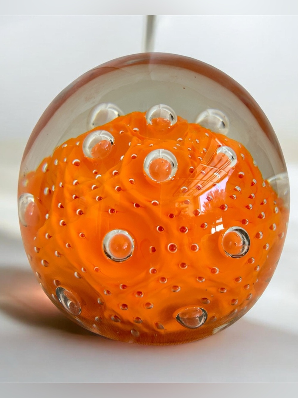 Orange Art glass Bullicante round paperweight 3”